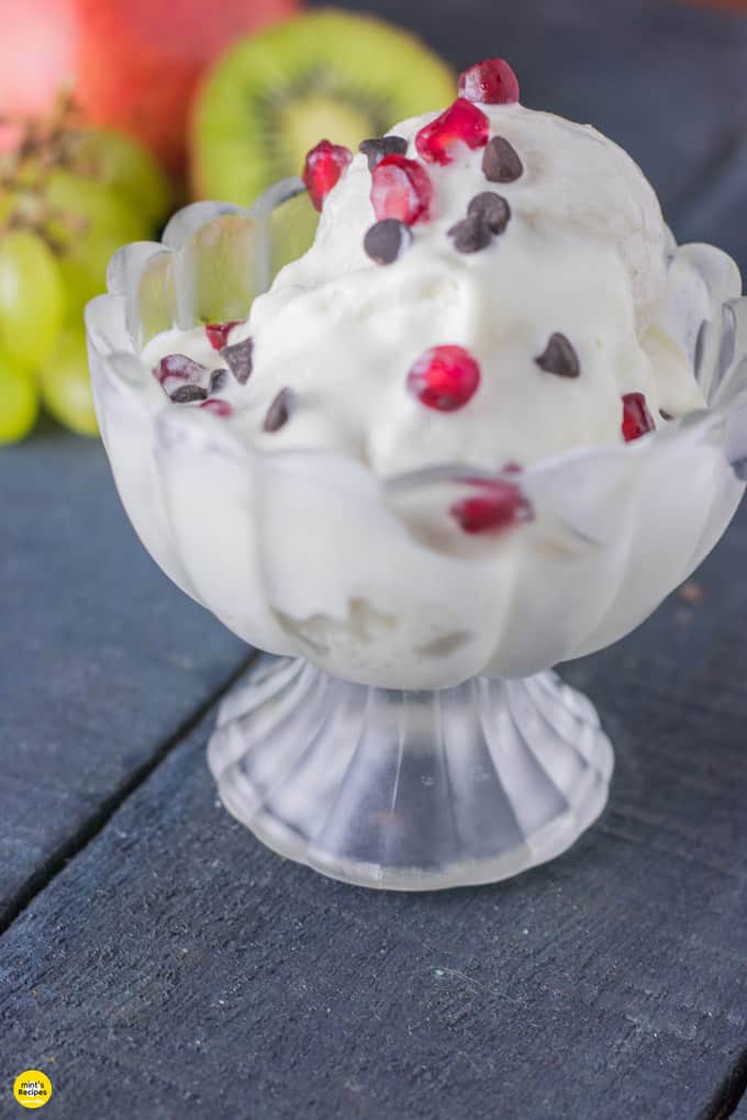 Corn rasgulla ice cream made with stuffing of mixed fruit Corn-rasgulla-icecream on a glass bowl