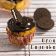 12 Tasty and Easy Cake Recipes Oreo Cupcake on a steel rods with frosting of chocolate ganache and half oreo biscuits on it and some oreo cupcakes on the background |