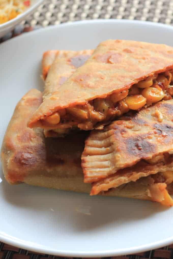 Pizza paratha on a black plate Pizza paratha on a black plate