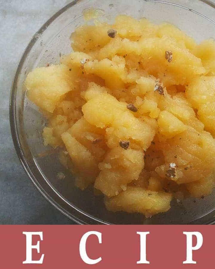 Aloo ka Halwa on transparent bowl and some cardamom powder for garnish keeped on a marble surface|