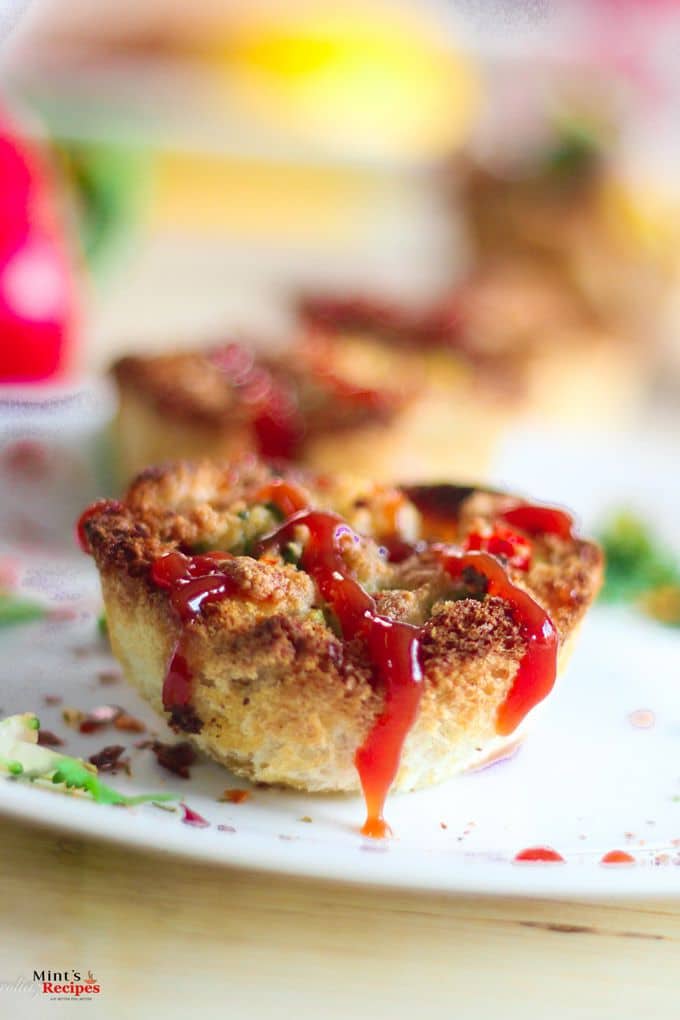 Baked Veg Bread Pizza on a plate with some parsley leafs.stuffing of veggies in the tokri |