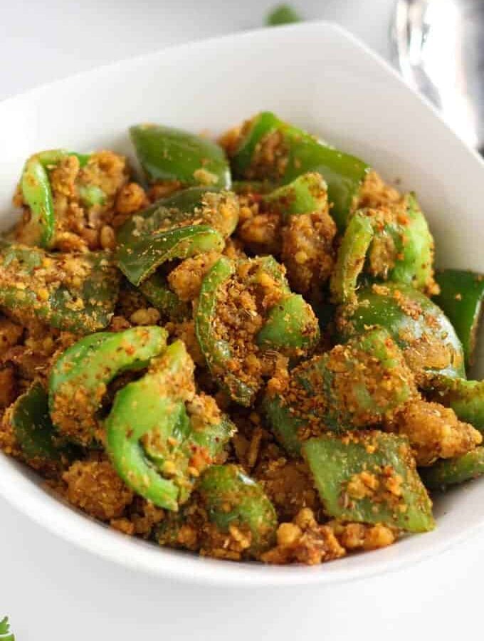 Besan Shimla Mirch on a white bowl