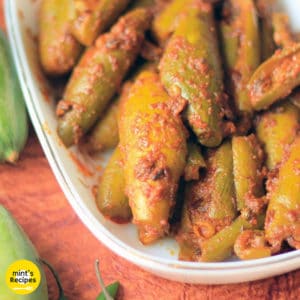 Bharwa Parval on a white bowl with some green chili