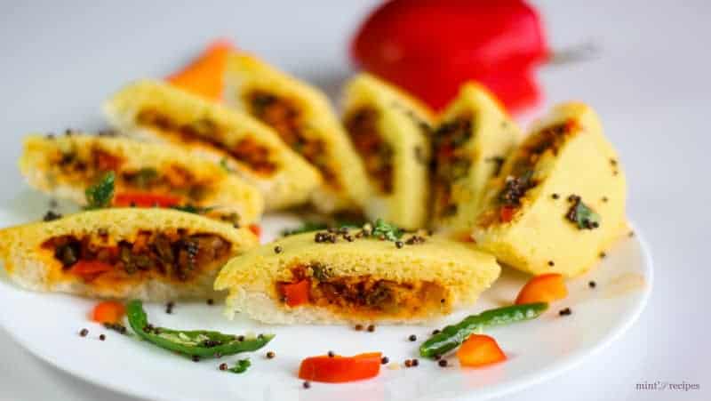 Bread dhokla sandwich on a white plate 