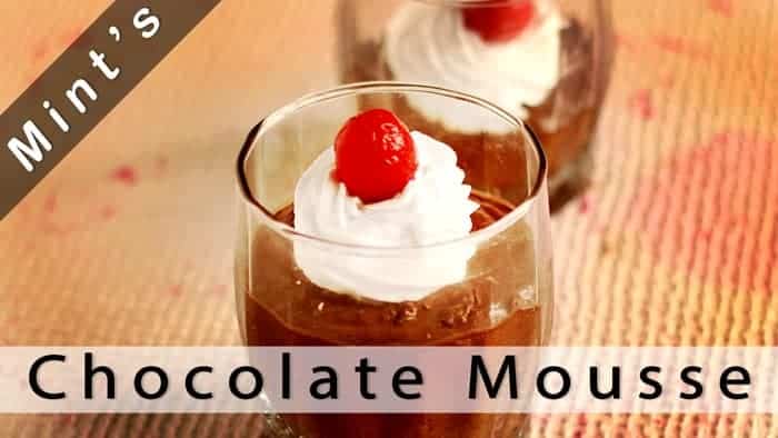 Chocolate Mousse on a glass with some whipped cream