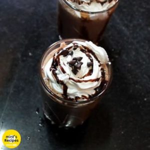 Chocolate milkshake on a glass with choco chips