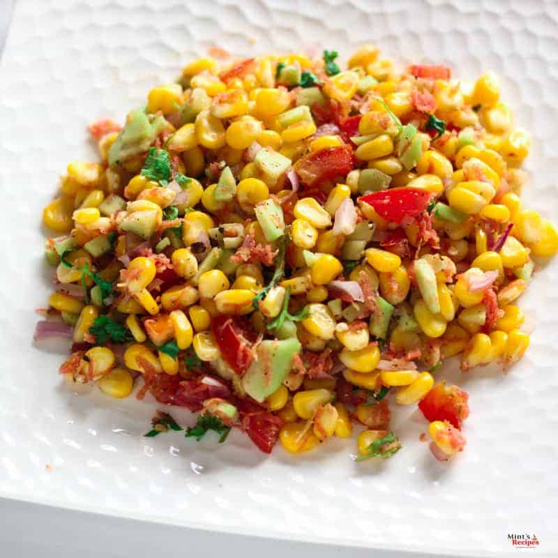 Corn Salad palced on white plate