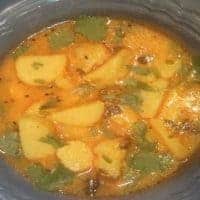Dahi Arbi RecipeDahi arbi Recipe | In a Glass bowl Dahi Arbi Curry Garnished With Coriander leaves |