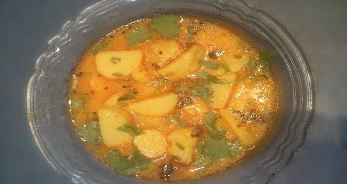 Dahi Arbi RecipeDahi arbi Recipe | In a Glass bowl Dahi Arbi Curry Garnished With Coriander leaves |