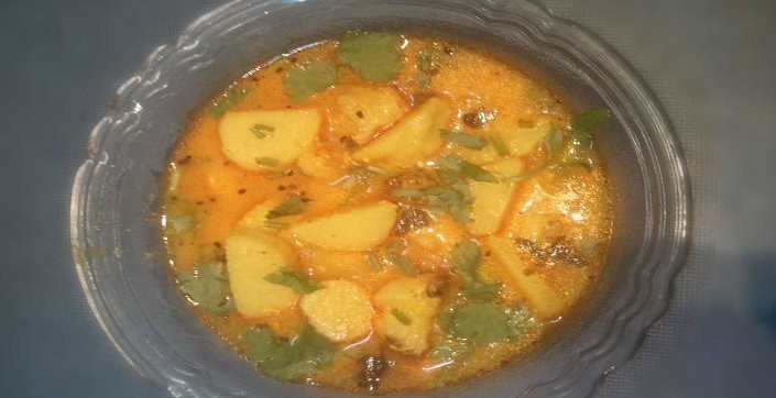 Dahi arbi Recipe | In a Glass bowl Dahi Arbi Curry Garnished With Coriander leaves | 