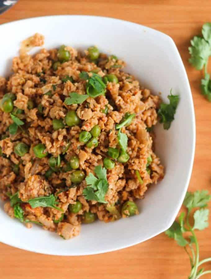 Dry Soya Peas on a white bowl with garnish with coriander leaves