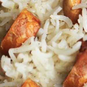 Rajasthani gatte ka pulao on a white plate garnished with fried cashew and gatte |