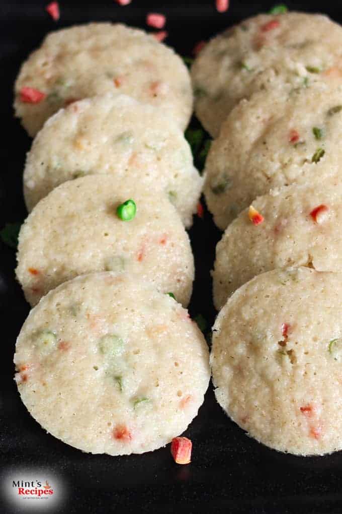 Oats Idli on a black plate 