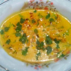 Indian Curry with Besan ka Chilla on a flower printed plate garnish white chopped coriander leaves |www.mintsrecipes.com |