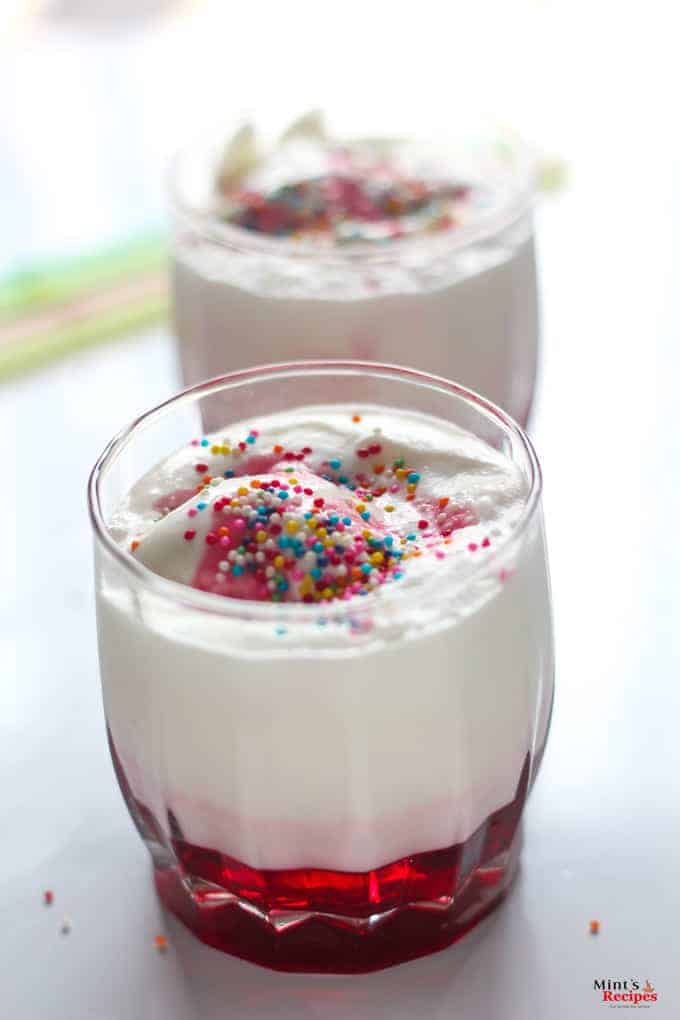 Italian Cream Soda in a glass with vanilla icecream and sprinklers and some syrup