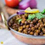 Dry Kala chana recipe pressure cooked with some oil, whole gram spices and onion with some masala and coriander leaves and cooked it till get soft|