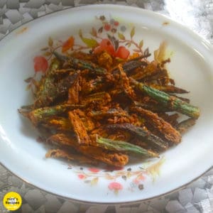 Kurkure bhindi on a floural print white plate