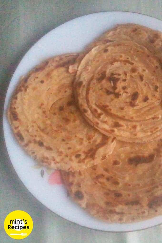 Lacch Paratha on a white flower printed plate 