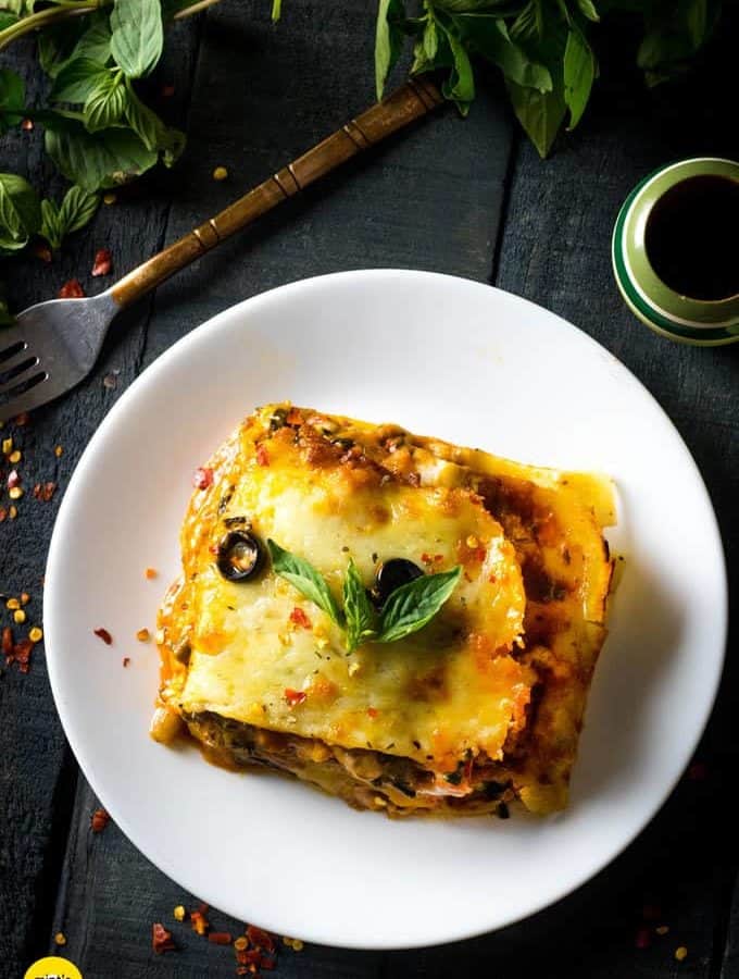 Italian Lasagna with cheese served on a white plate