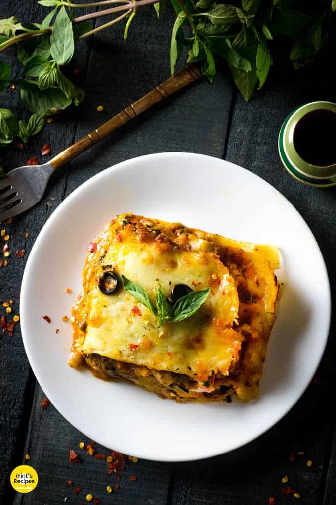Italian Lasagna with cheese served on a white plate