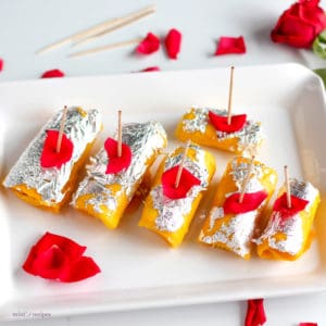 Mango Cheese Rolls Recipe |Sweet Mango Slices filled with paneer stuffing and beautifully decorated with silver leafs and rose petels