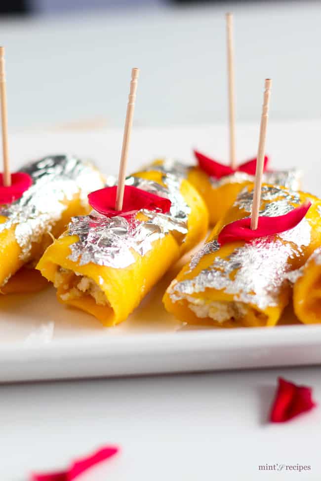 Mango Cheese Rolls beautifully decorated with silver leafs and rose petels 