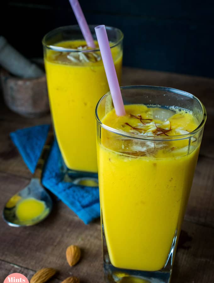 Mango Lassi on a glass with some ice cubes