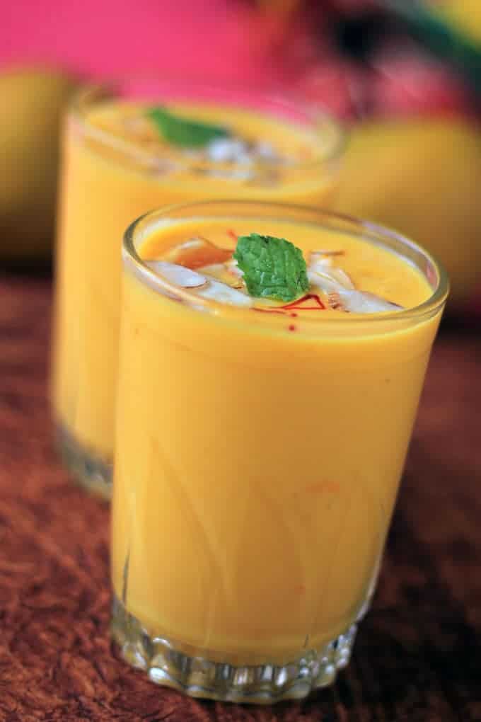 Mango Lassi on a glass with some ice cubes 