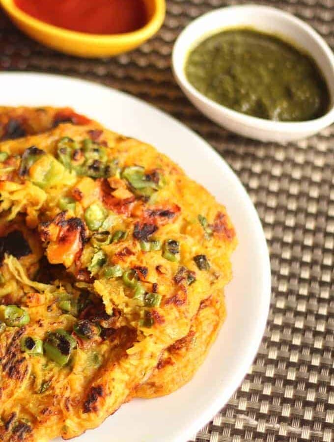 Potato Laccha Pancake on a white plate and garnished with some coriander leaves