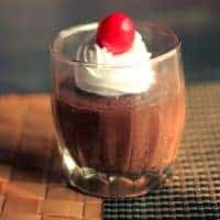 Quick Chocolate Mousse on a glass with some whipped cream