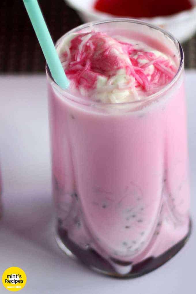 Rose Milkshake on a glass filled with rose milkshake and vanilla ice cream