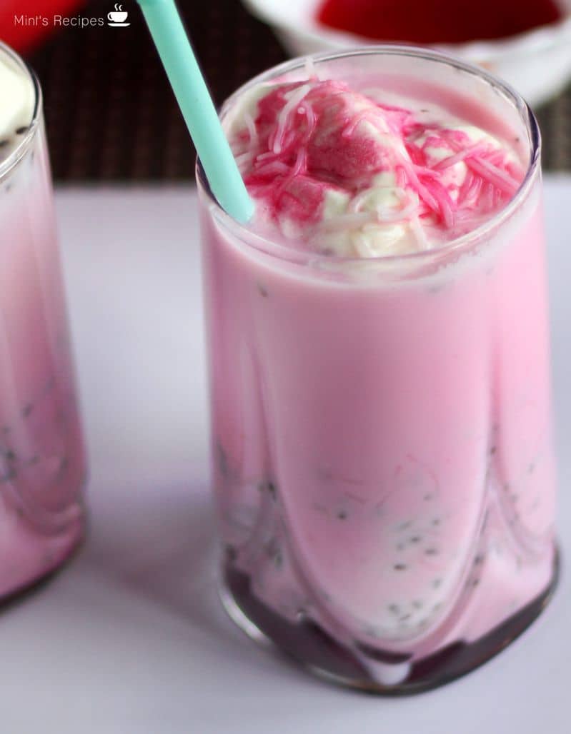 Rose Milkshake on a glass filled with rose milkshake and vanilla ice cream