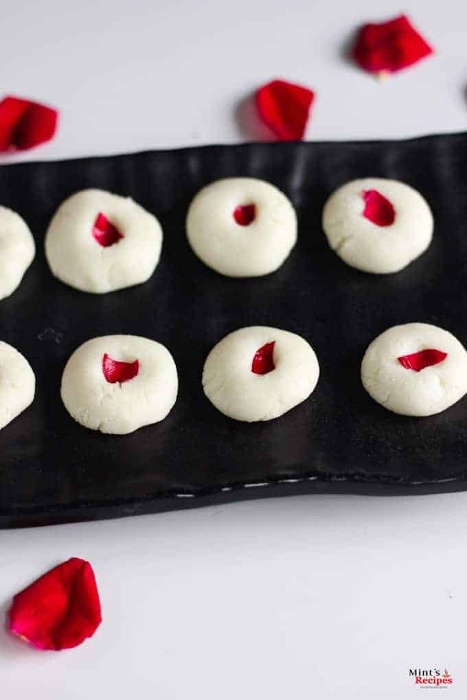 Rose Sandesh on a black plate