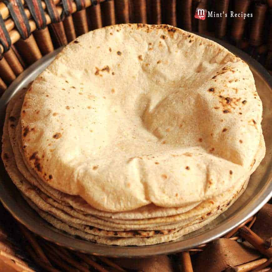 Roti, Chapati, Phulka on a steel plate in the wooden basket