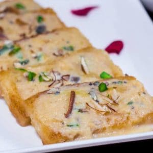 Shahi Tukda Recipe served with chopped almonds and pistachios