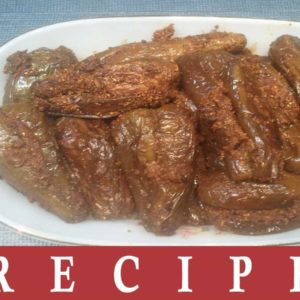 Stuffed Brinjal | Bharwa Baingan on a white tray on a white background |
