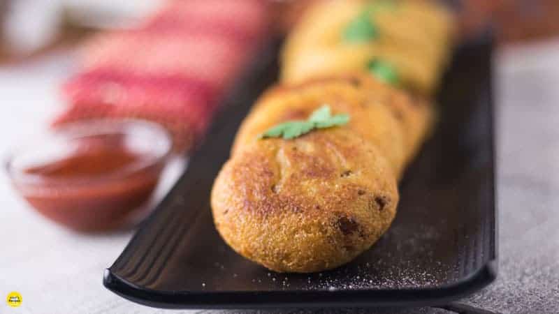 Suji ki kachori on a white plate with some green chutney garnish with coriander leaves