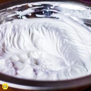 Whipped cream on a glass bowl