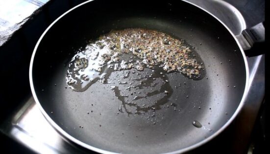 Jeera and oil in a pan