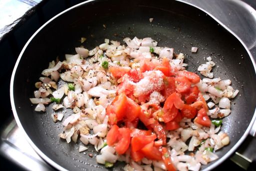 Tomato and onion in a pan